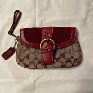 Coach red and brown clutch.